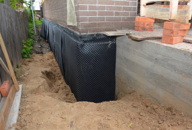 Happy homeowners after waterproofing job in Catawba
